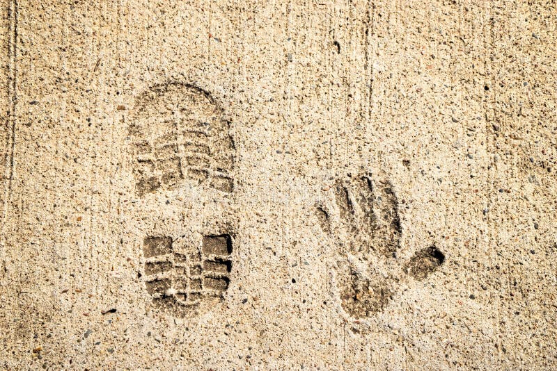 Shoe And Hand Print In Cement Stock Photo - Image of concrete, shoe