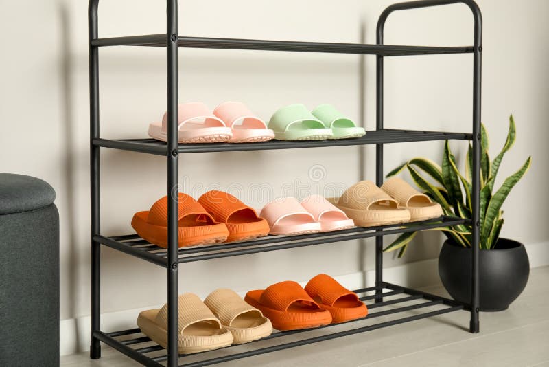 Shoe Rack with Different Pairs of Rubber Slippers Near White Wall Indoors Stock Photo Image of footwear beautiful 252353520