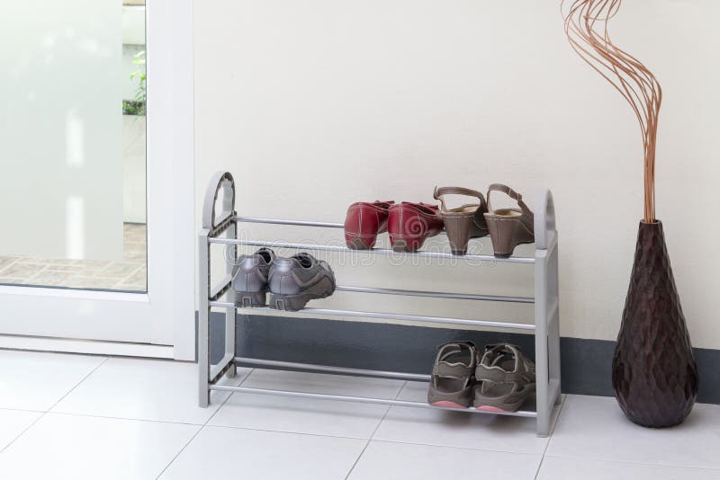 A small shoe shelf with women shoes