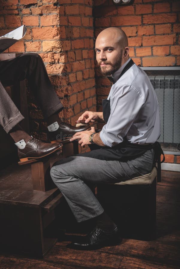 Shoe Shiner Working and Not Paying Attention Stock Photo Image of