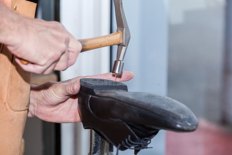 The Shoemaker Repairs a Shoe Stock Image Image of craftsman, machine