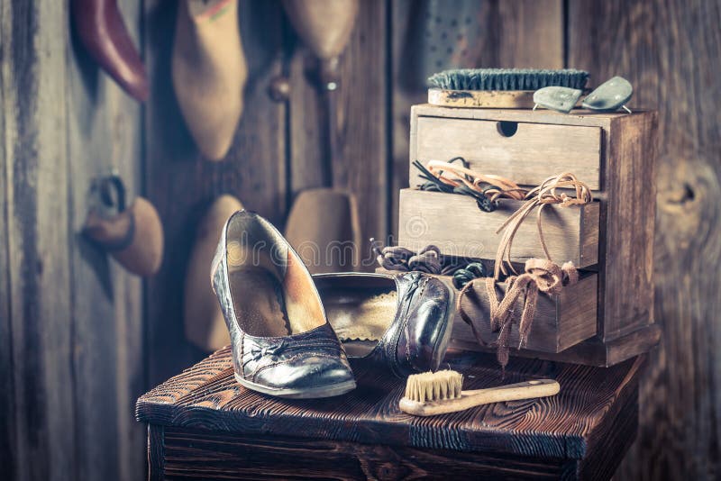 Shoemaker workshop with shoes, tools and laces