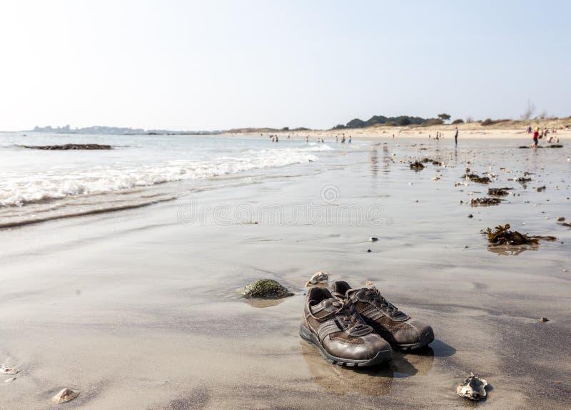 Shoes on the Beach stock photo. Image of pair, shoes 27008116