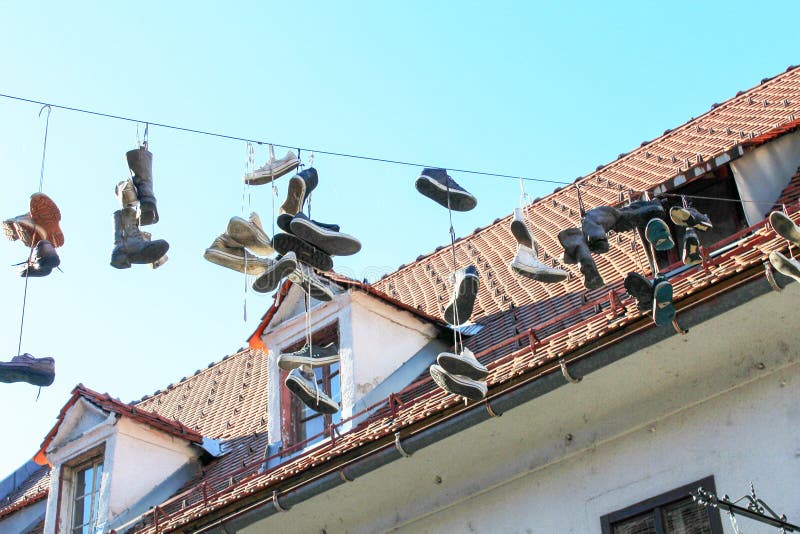 Shoes Hanging by Shoelaces on a Wire Stock Image Image of dangling, electric 69685161