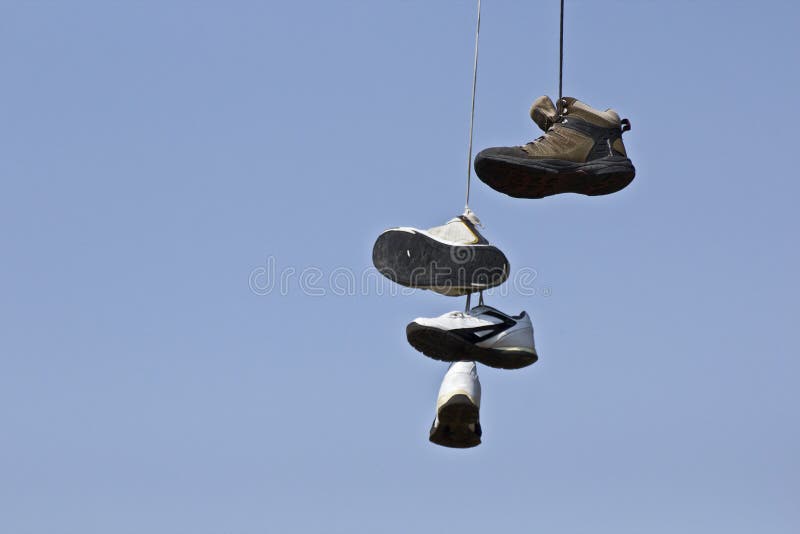 Many Shoes Hanging in Tree stock photo. Image of strange 27093148