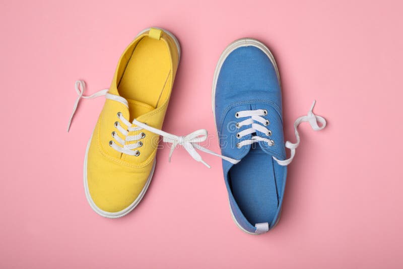 Shoes Tied Together on Pink Background. April Fool`s Day Stock Photo ...