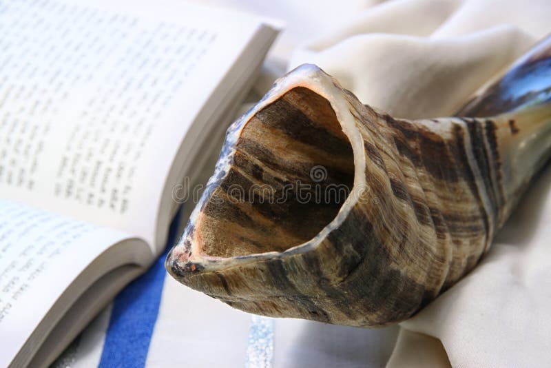Shofar (horn) on white prayer talit. room for text. rosh hashanah (jewish holiday) concept . traditional holiday symbol. stock photography Shofar (horn) on white prayer talit. room for text. rosh hashanah (jewish holiday) concept . traditional holiday symbol. stock photography