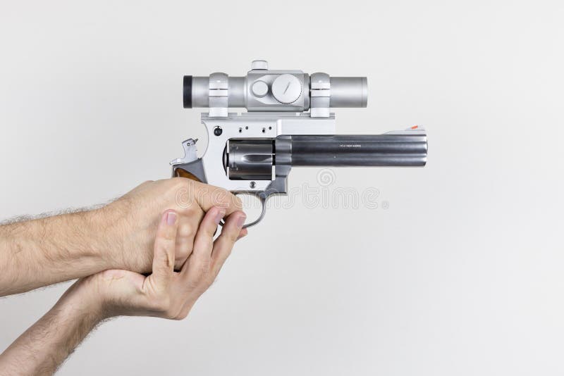 Shooter holds .357 Magnum Revolver stock photography