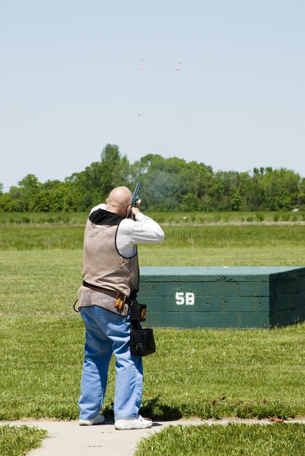 Breaking a clay pigeons at a trap shoot range. Breaking a clay pigeons at a trap shoot range