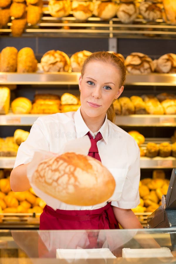 https://thumbs.dreamstime.com/b/shopkeeper-bakery-giving-bread-to-customer-saleswoman-presenting-32445270.jpg