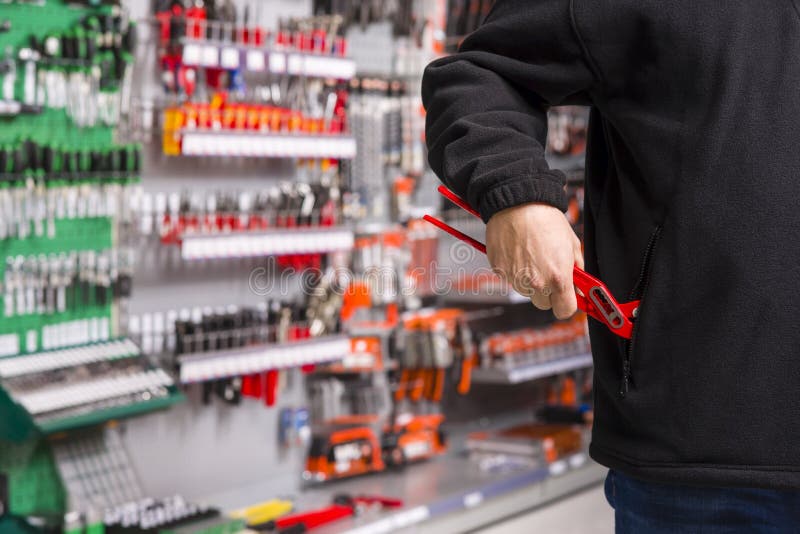 Shoplifter at work stock photography