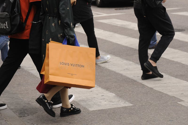 25 May 2023/ Consumers wait at Louis Vuitton store in danish capital  Copenhagen on stroeget pedestrain stree. (Photo.Francis Joseph Dean/Dean  Pictures Stock Photo - Alamy