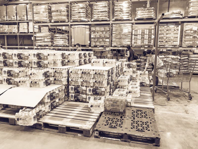 Shoppers Stocking Bottled Water At Costcow Warehouse Store