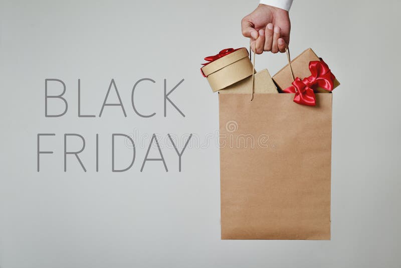 Shopping bag full of gifts and text black friday