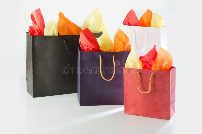 Shopping bags with color papers royalty free stock images