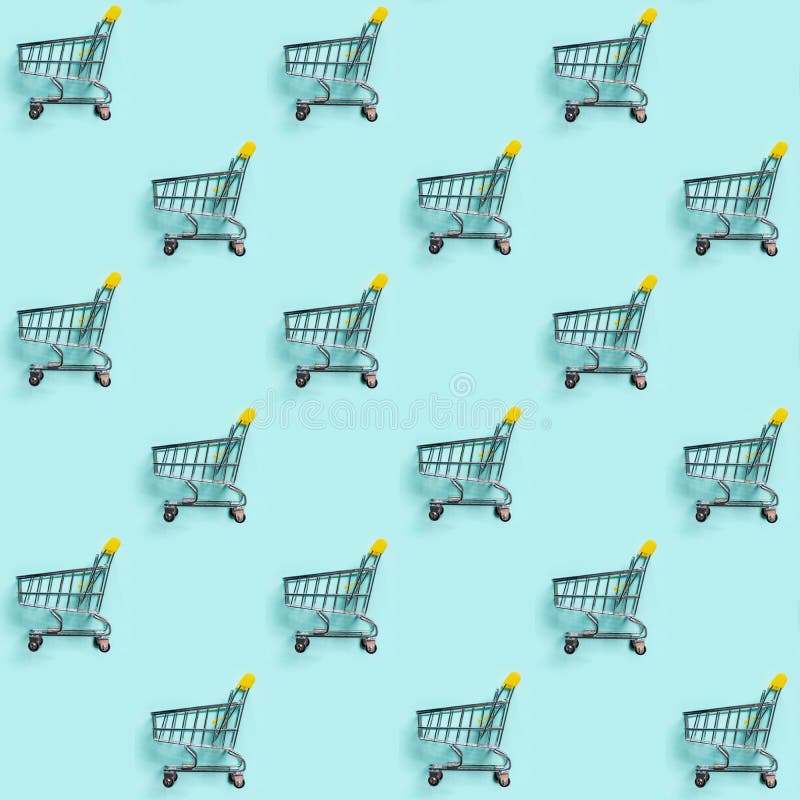 Shopping cart staggered on blue. Seamless pattern royalty free stock photography Shopping cart staggered on blue. Seamless pattern royalty free stock photography