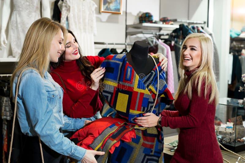 Shopping, Fashion and Friendship Concept - Three Smiling Friends Trying ...