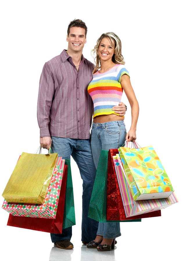 Shopping couple smiling. Isolated over white background. Shopping couple smiling. Isolated over white background