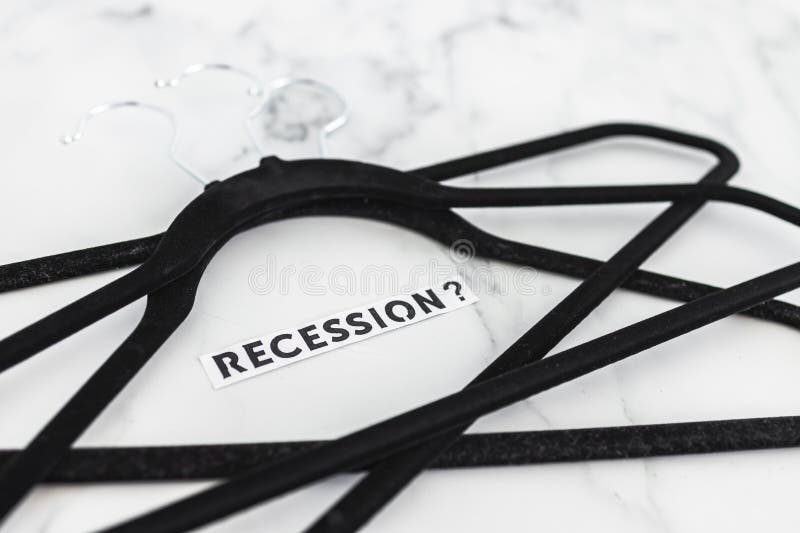 Shopping and purchasing power, group of clothes hangers with Recession text in the middle concept of buyers reducing their royalty free stock photos Shopping and purchasing power, group of clothes hangers with Recession text in the middle concept of buyers reducing their royalty free stock photos