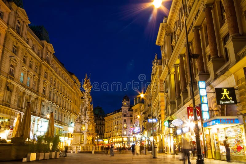 Vienna, Austria: Louis Vuitton shop facade in the city center illuminated  in the night Stock Photo