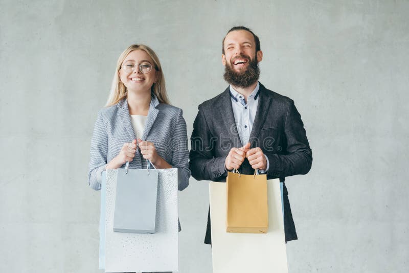 Shopping therapy happy smiling couple hold bags royalty free stock photography Shopping therapy happy smiling couple hold bags royalty free stock photography