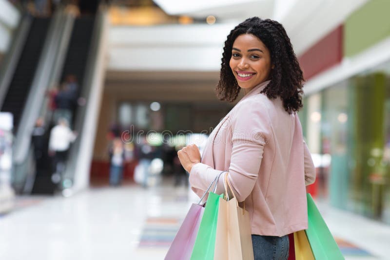 Shopping Weekend. Smiling Black Woman Walking in Department Store with ...