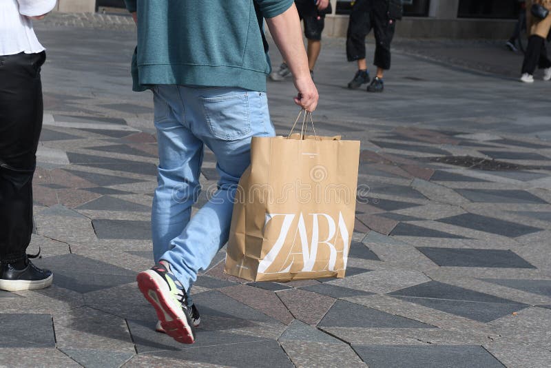 Shoppper with Spanish retaol Zara stoe shopping bags in  Copenhagen