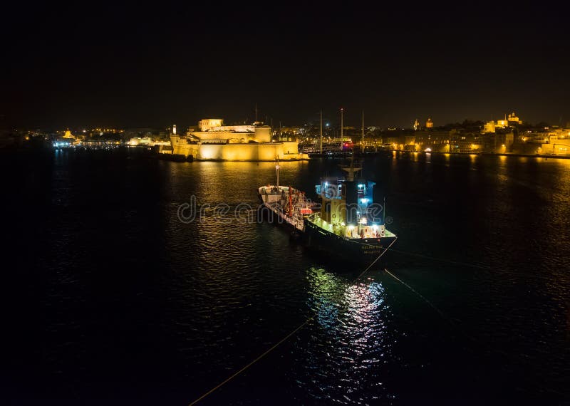 Shores of Birgu, Bormla, Kalkara. The ship is in the dark. The embankment of Valletta. Malta stock images Shores of Birgu, Bormla, Kalkara. The ship is in the dark. The embankment of Valletta. Malta stock images