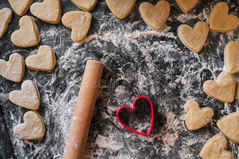 Shortbread Cookie Cutter and Rolling Pin on a Floured Table Stock Image