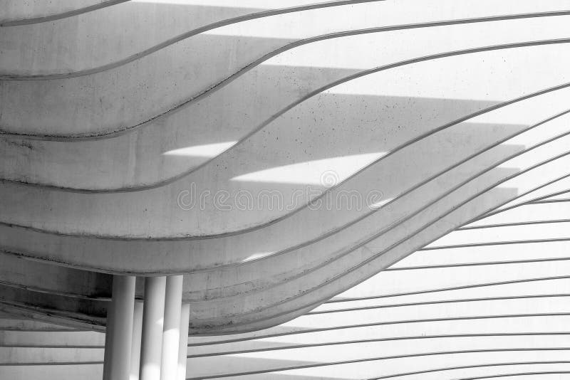 Shot of Architectural Wall Art with Pattern Lines Over White Poles