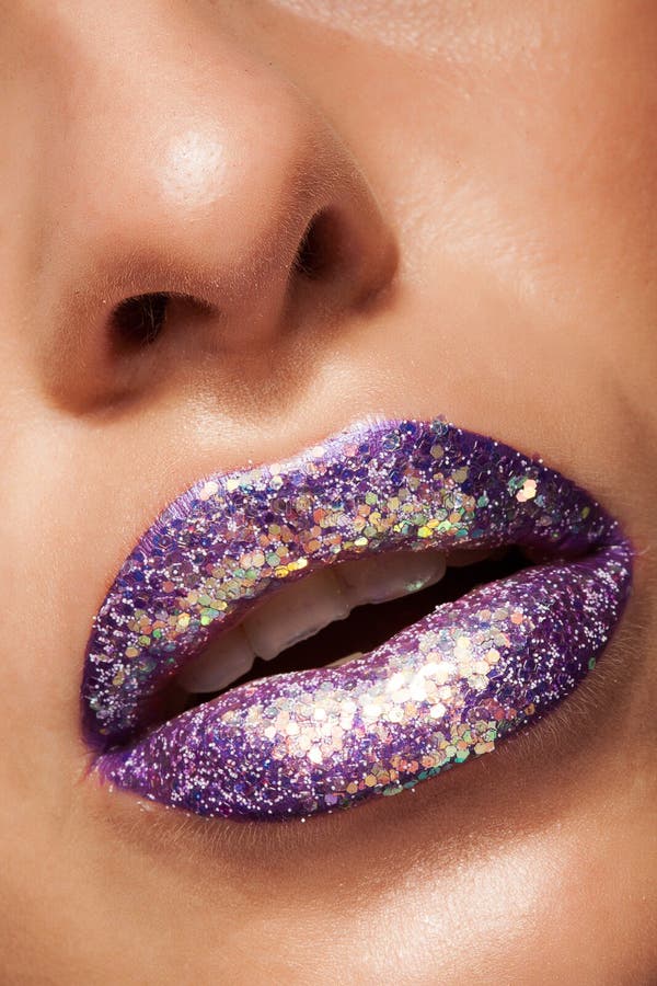 Shot of beautiful girl with purple lipstick and silver glitter