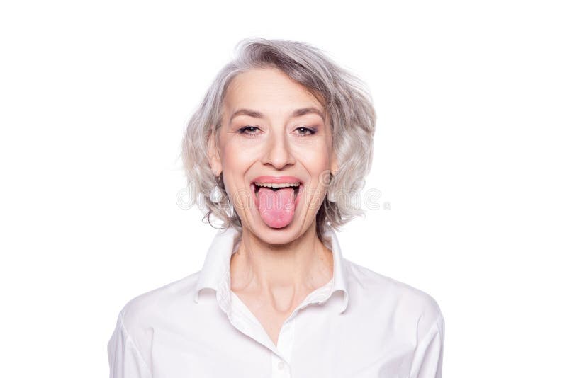 Shot Of A Beautiful Mature Woman Having Fun And Teasing Sticking Out Her Tongue Isolated On