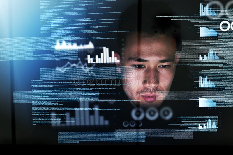 Coding all night long. Shot of a focussed computer programmer working at his computer late at night. royalty free stock photography