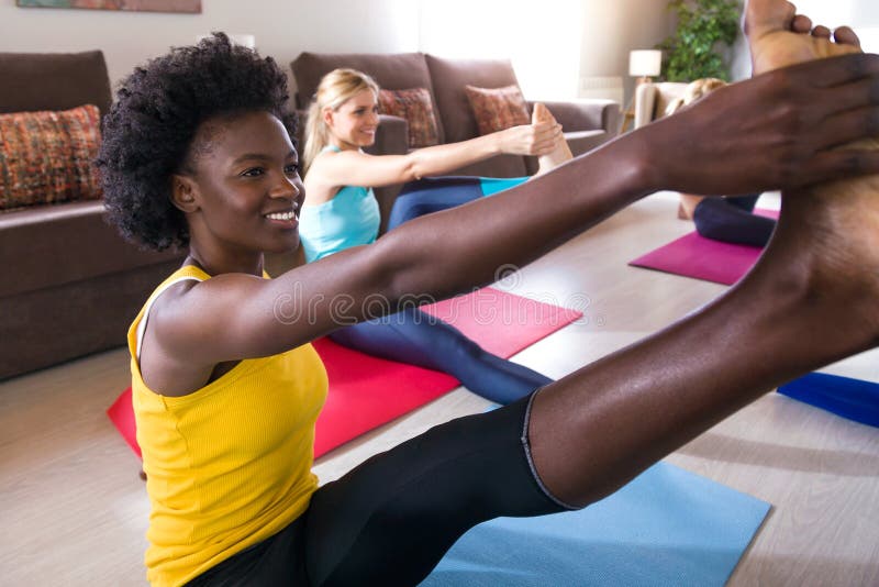 Teen girl doing yoga at home - a Royalty Free Stock Photo from