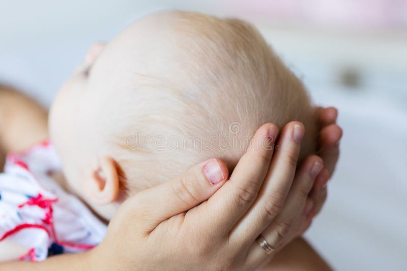 Shot of happy mother holding her baby girl. Summer vacation stock image Shot of happy mother holding her baby girl. Summer vacation stock image