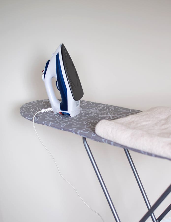 An Iron on an Ironing Board Stock Photo Image of press, indoor 182614328