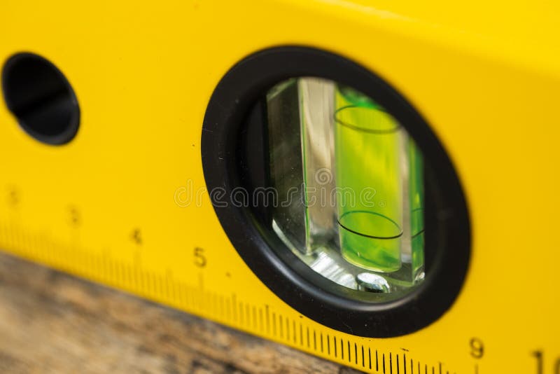 Shot of a level tool , yellow block level with bubble clipping path included. stock photo
