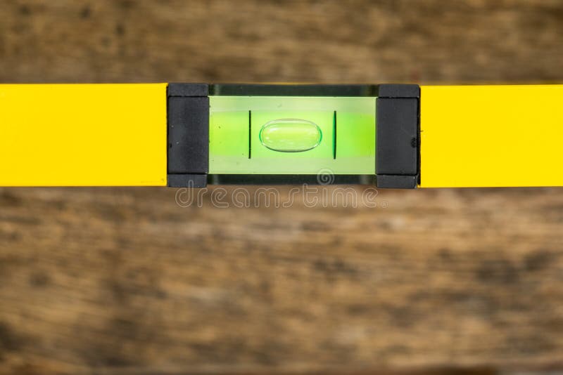 Shot of a level tool , yellow block level with bubble clipping path included. stock photography