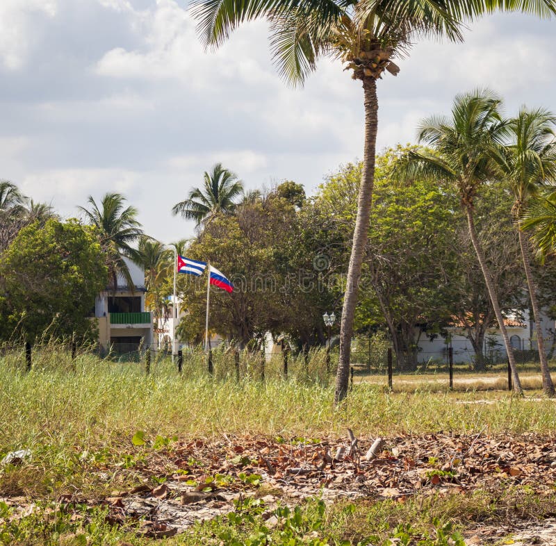 Shot of the Russian and Cuban flags floating on the wind. Countries royalty free stock images