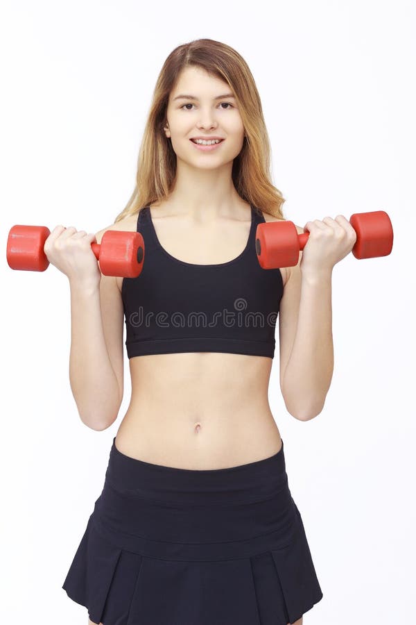 Shot of a sporty young woman with dumbbells.