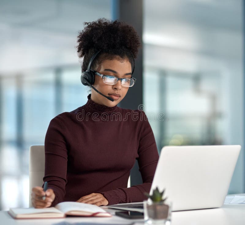 The Key Is To Prioritise Shot Of A Young Female Agent Listening