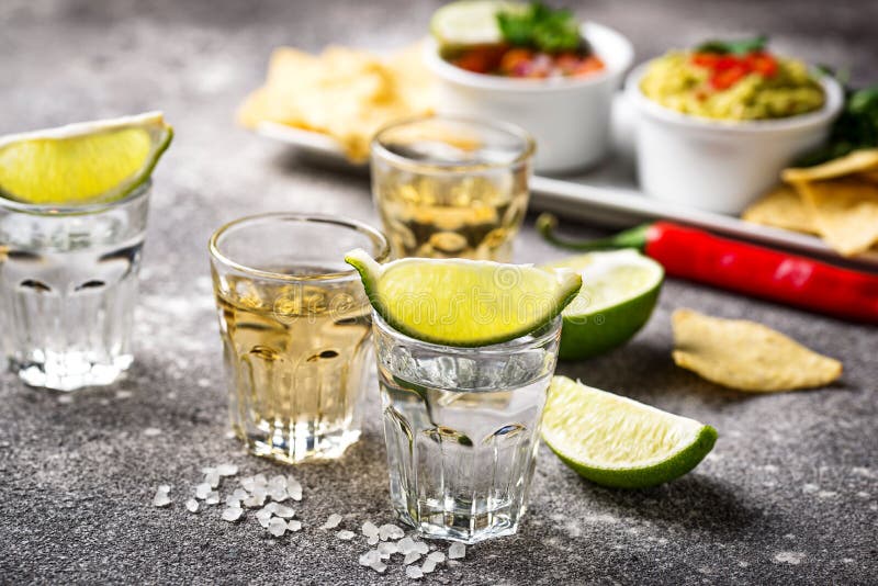 Shots of Silver and Gold Tequila Stock Image Image of glass, golden