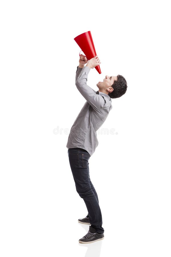 Shouting into a megaphone. Young man shouting into a megaphone over a white background Shouting into a megaphone. Young man shouting into a megaphone over a white background