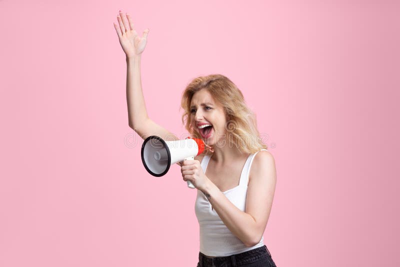 Caucasian young woman`s portrait  on pink studio background. Beautiful female model. Concept of human emotions