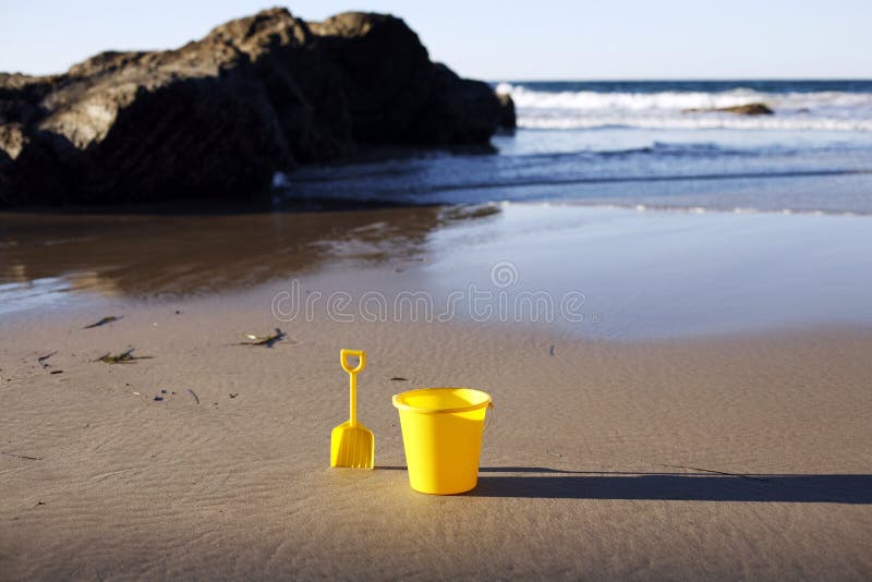 Shovel and bucket on beach stock image. Image of holiday 8917647