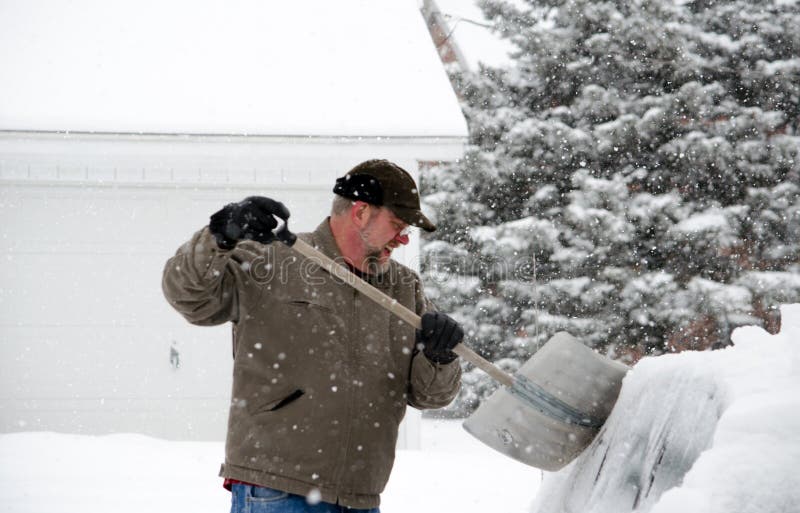 Shoveling snow off the car stock photo. Image of seasonal 29583386