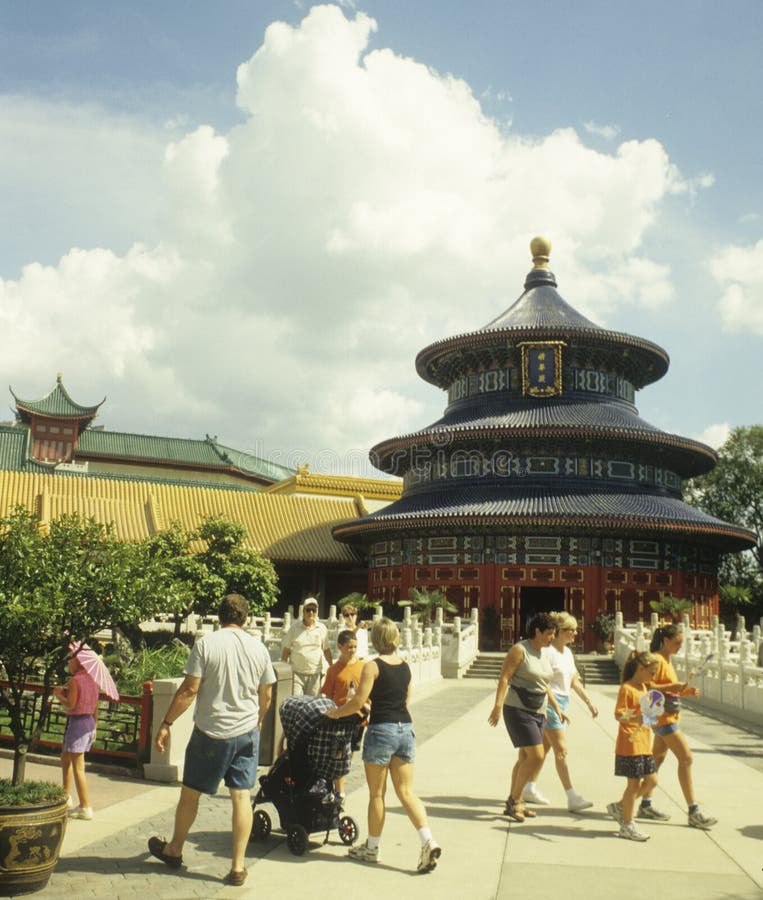 People walk past the China exhibit at Disney World EPCOT World Showcase - China. People walk past the China exhibit at Disney World EPCOT World Showcase - China.