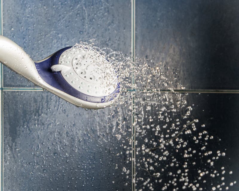 Shower Head with Water Drops Levitate about and Place for Text Stock