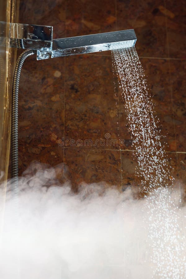 Shower with water stream and hot steam