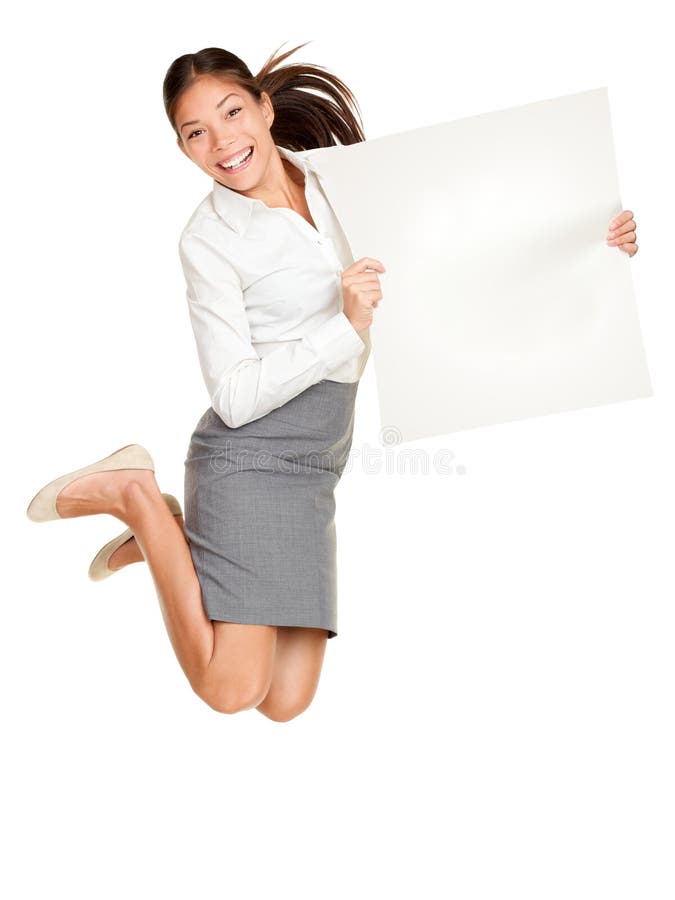 Showing sign. Woman jumping holding poster of paper, blank and empty with copy space. Casual business woman jumping excited smiling happy and cheerful isolated on white background. Showing sign. Woman jumping holding poster of paper, blank and empty with copy space. Casual business woman jumping excited smiling happy and cheerful isolated on white background.